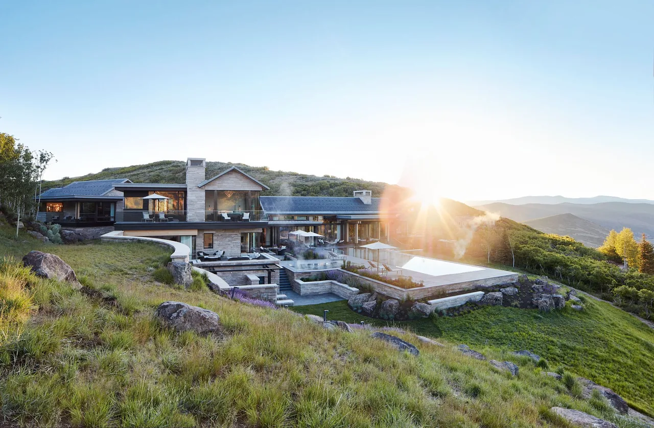 Morning Star Residence features an integrated pool and stone pillars, set on a hillside with modern design details.