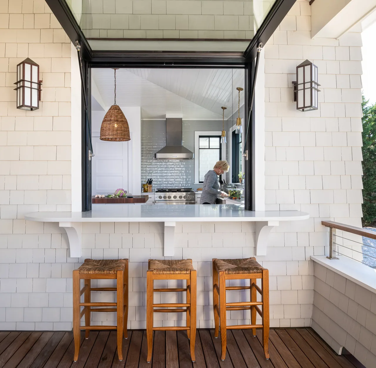 The Porch Talk House in Seaside Park features an outdoor porch bar counter adjacent to the kitchen with a large open window connection.
