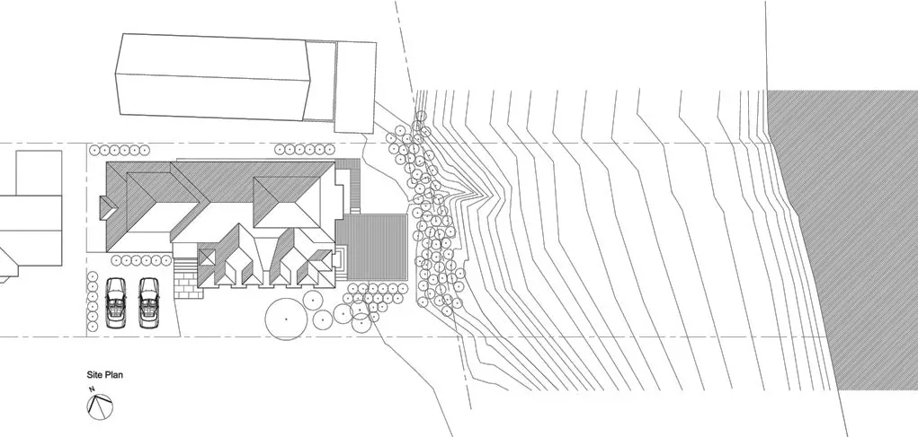 Site plan of South Surf Road house showing building layout, driveway with two cars, and surrounding landscape with contour lines.