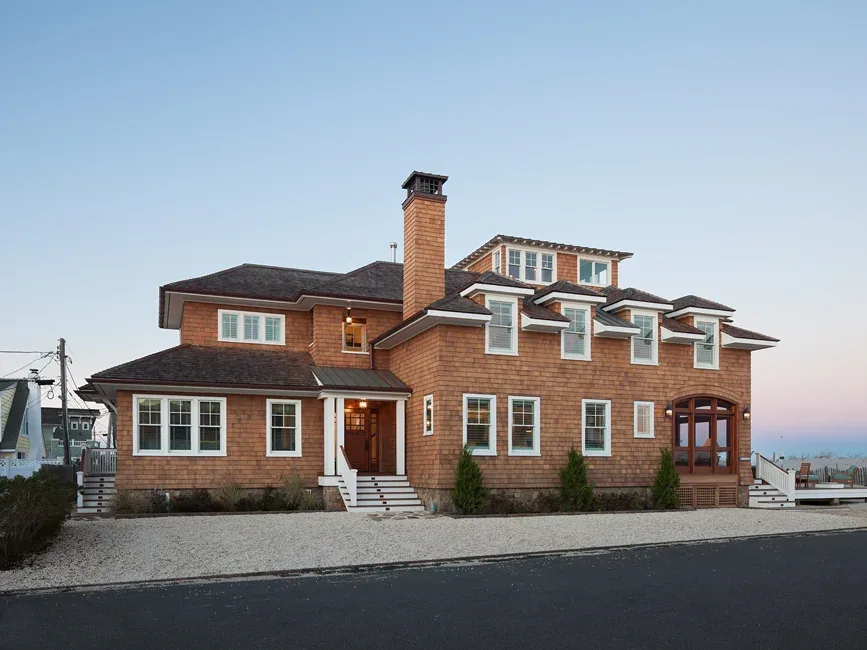 South Surf Road residence with shingle siding and multiple dormer windows overlooking the beach.