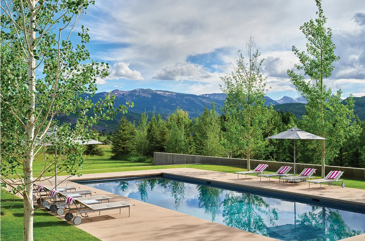 Mountain Modern project features a pool area with seating and scenic mountain backdrop.
