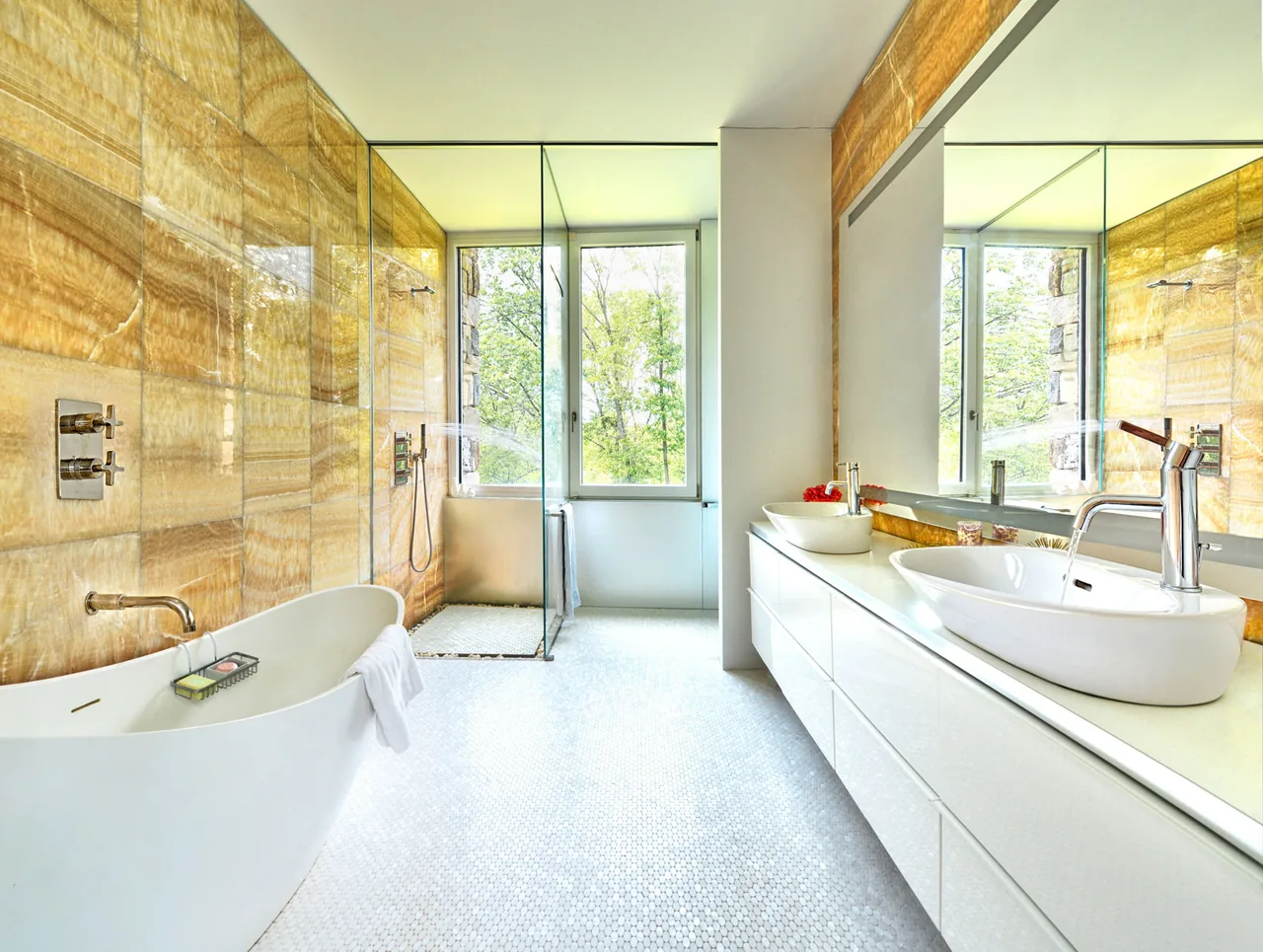 Bathroom in House 432 by Robert Siegel Architects features a freestanding tub, walk-in shower, and large window.