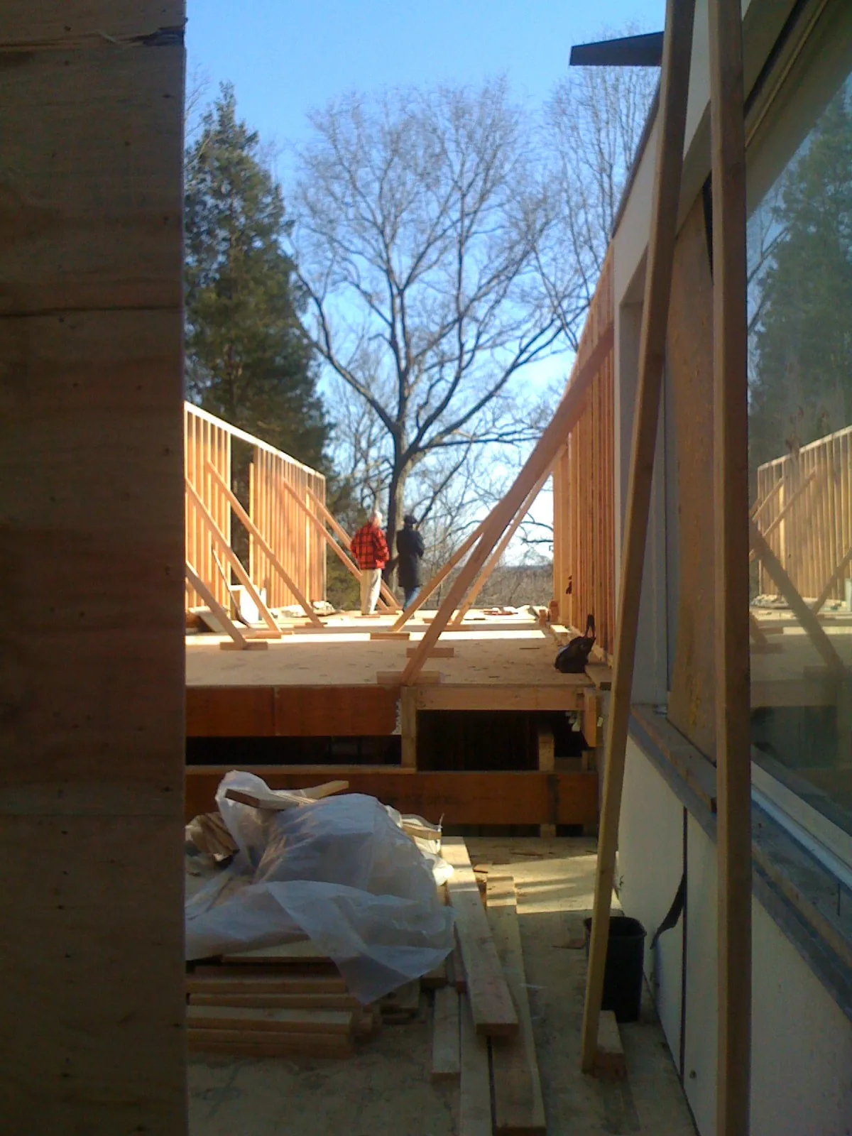 View of the wood framing and subfloor during early construction of House 125 by Robert Siegel Architects.