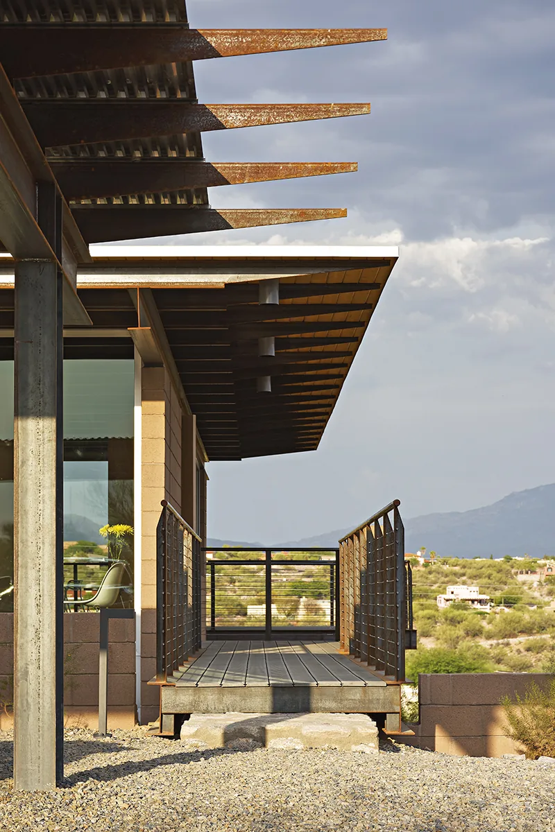 The DWC House features a metal-railing bridge and corrugated metal roof, designed by Rob Paulus Architects in Phoenix.