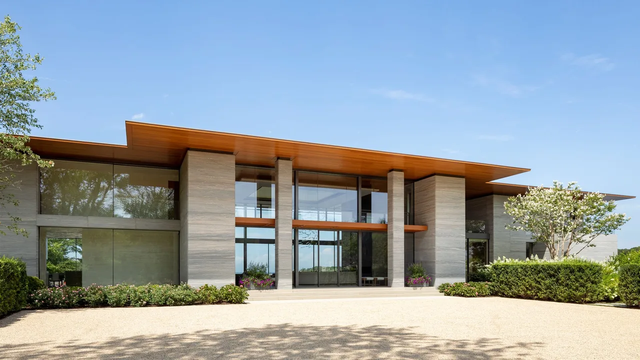 Millstone project features large floor-to-ceiling glazing and a flat roof with a wooden overhang by Roger Ferris + Partners.