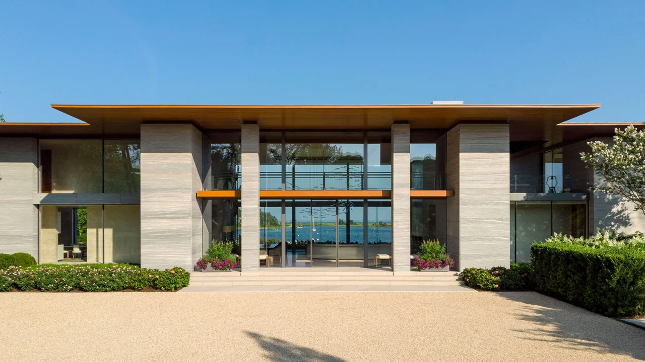 Exterior front view of Millstone project showing modern design with floor-to-ceiling glazing under a flat roof.