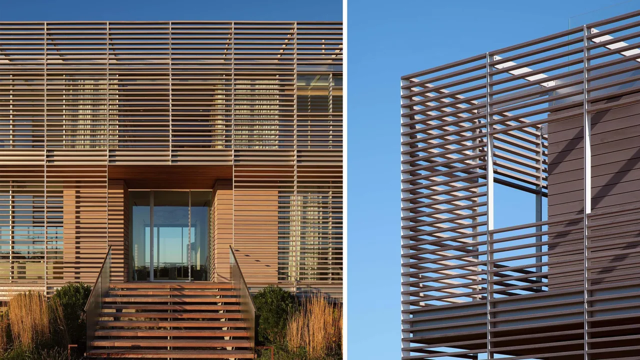 The Porch House features a two-story design with horizontal wooden slat screens and expansive large windows at the front entry.