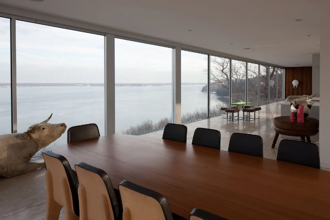 Clearhouse designed by Stuart Parr Design features large rectangular windows framing expansive water views.