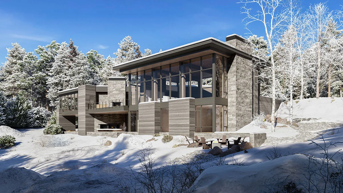 Moonlight Basin house designed by Silk Cavassa Marchetti features stone walls and a concrete chimney set in snow-covered woods with mountain views.