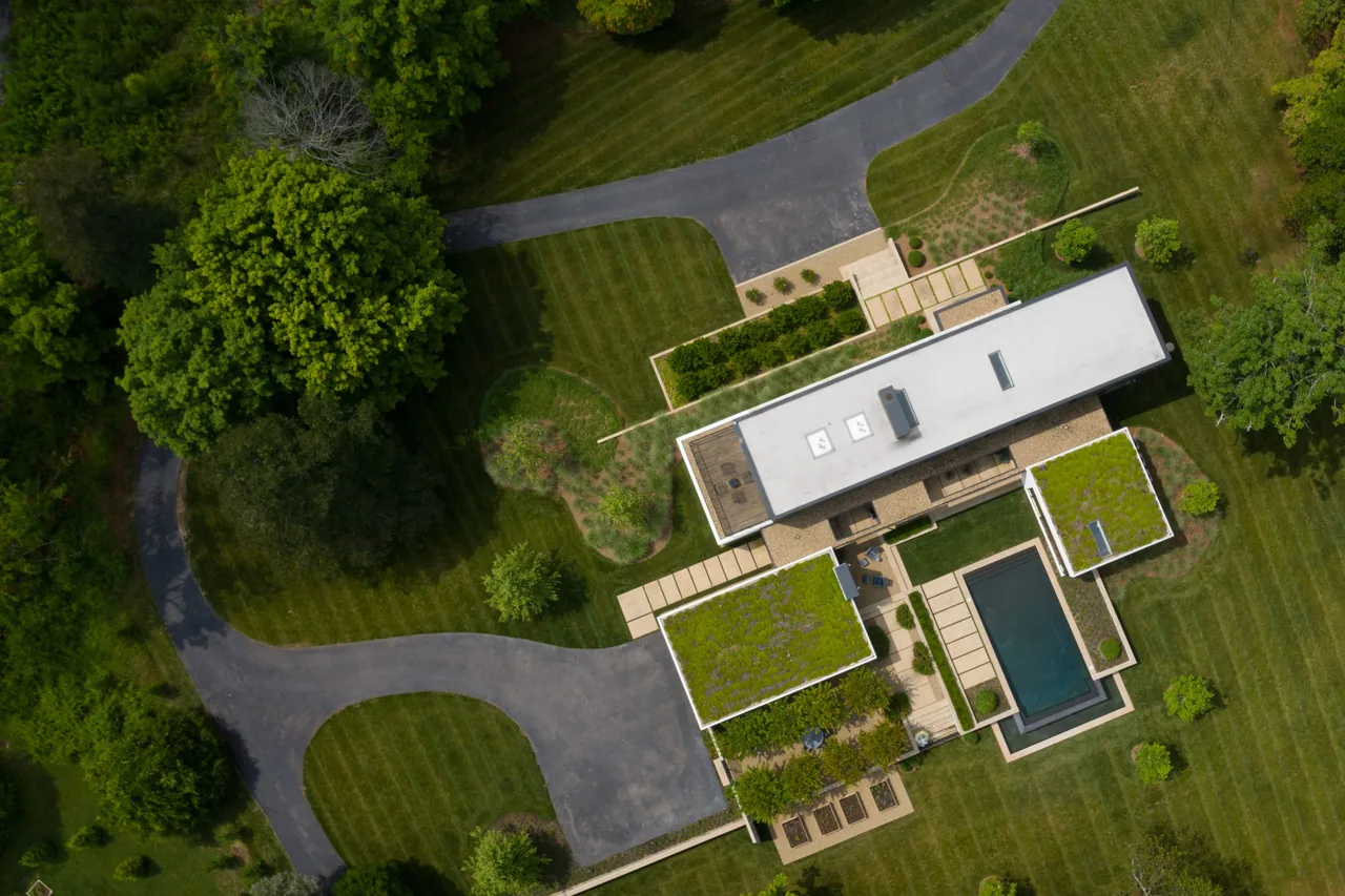 The Calloway Ridge House features green roofs and a landscaped courtyard with a rectangular reflecting pool.