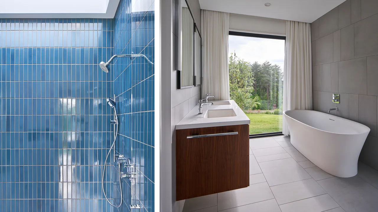 Bathroom features a blue tiled shower, freestanding tub near a floor-to-ceiling window, and a floating double vanity with a wood finish.