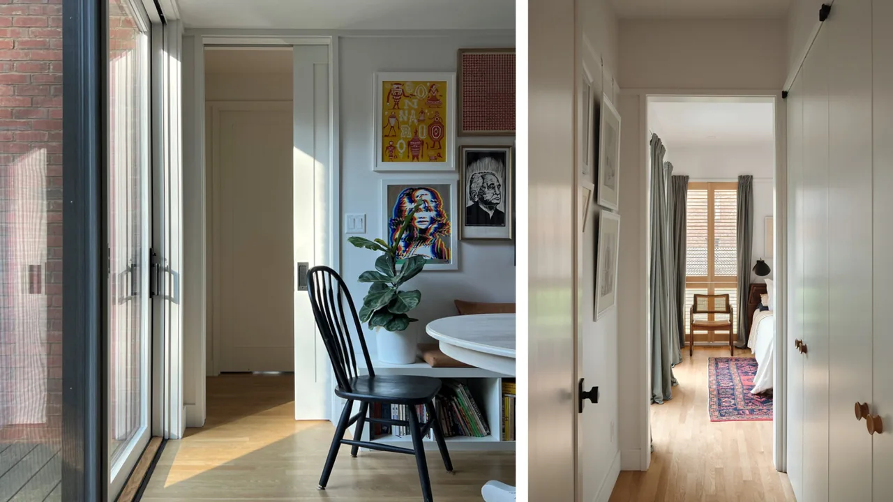 Interior with wooden flooring and walls featuring framed artwork and a hallway opening into a bedroom illuminated by natural light.