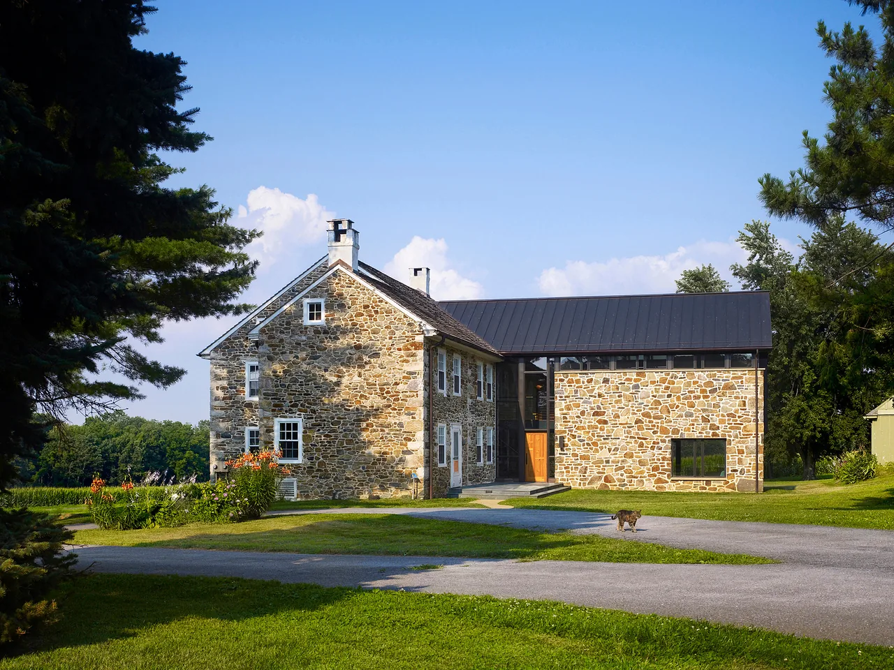 Elverson Addition features a stone exterior and a standing seam metal roof, blending historic and modern elements.
