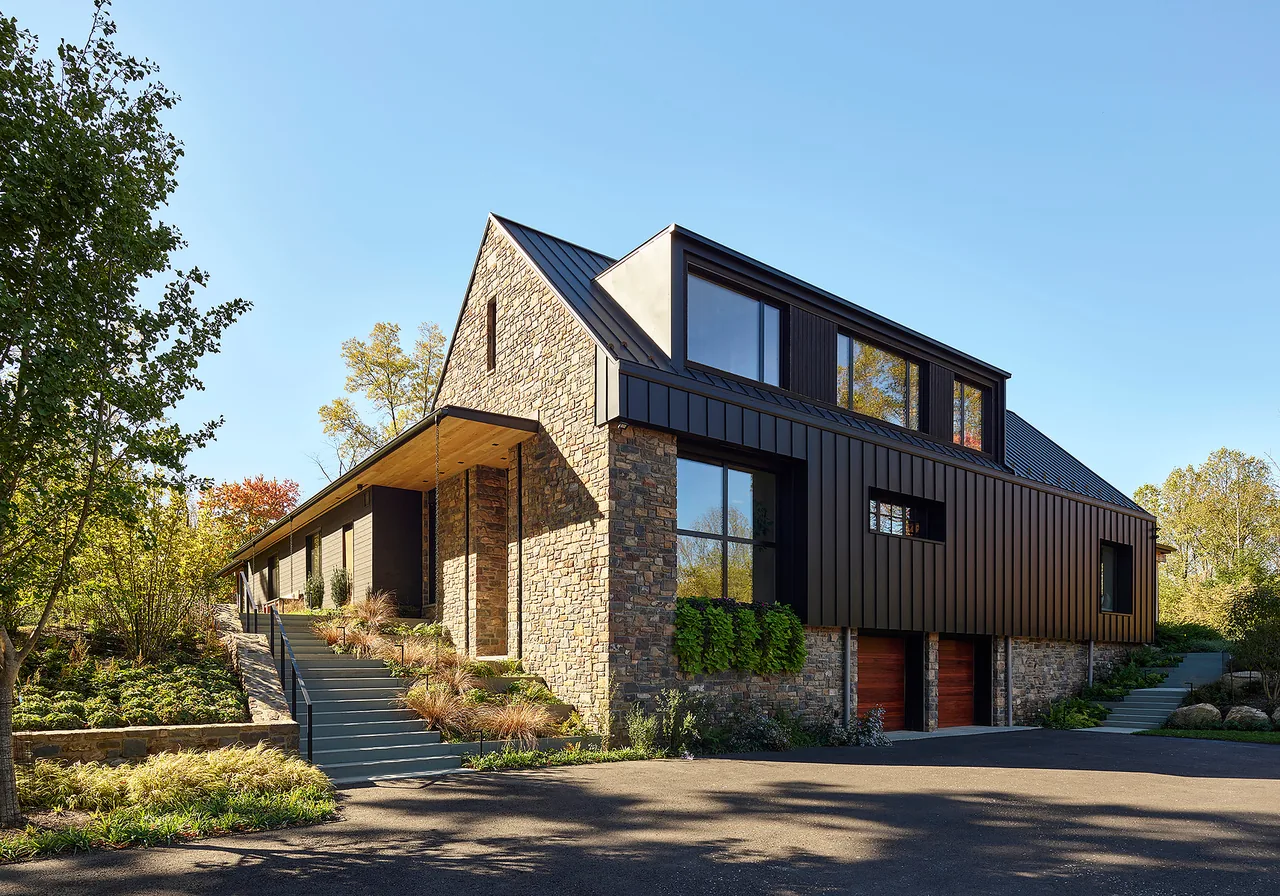 Bucks Retreat features a mix of stone and standing seam metal on its exterior facade.
