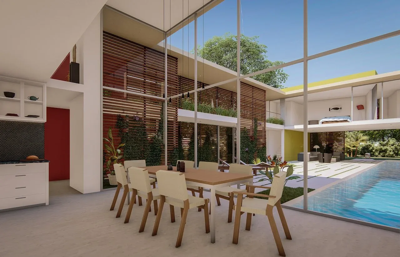 Dining room with woven seat chairs adjacent to an outdoor courtyard with a swimming pool and wood slat screens at Wilton House.
