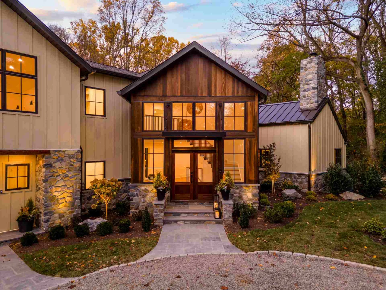 Exterior front of Parkside Sanctuary with wood and stone siding, wood-framed windows, and a gable roof by Millan Architects.