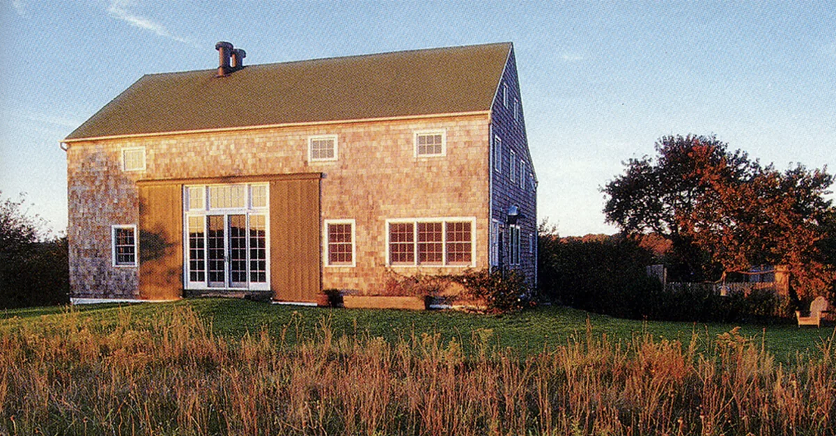 Middleton-Waln Barn Home features shingle siding and classic barn windows under a gable roof.