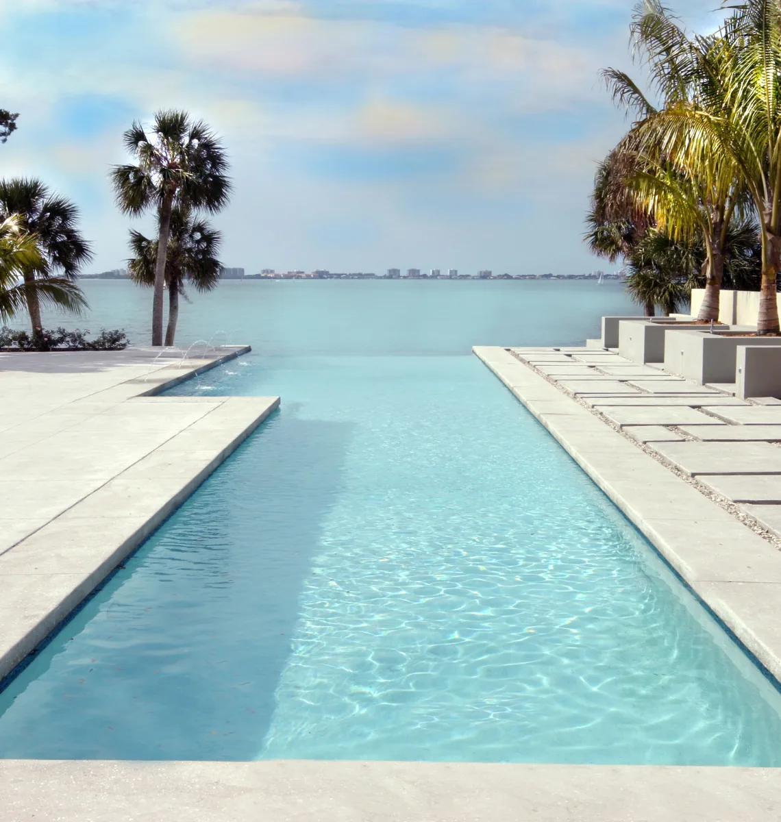 Infinity pool at Indian Beach Residence simply edges into the horizon of the nearby water body.