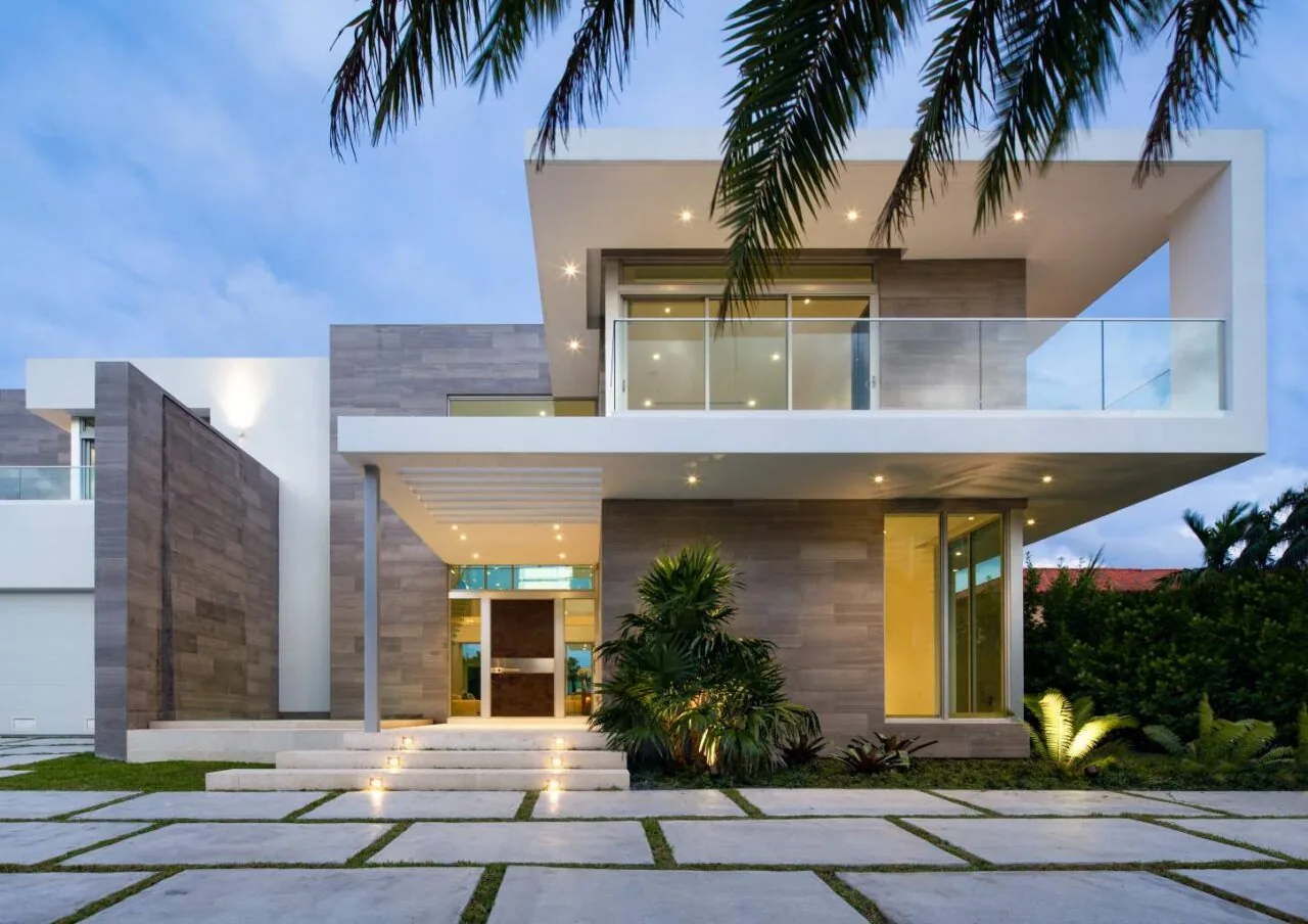301 Residence featuring a flat roof overhang, glass balcony railing, and illuminated outdoor steps at the entrance.