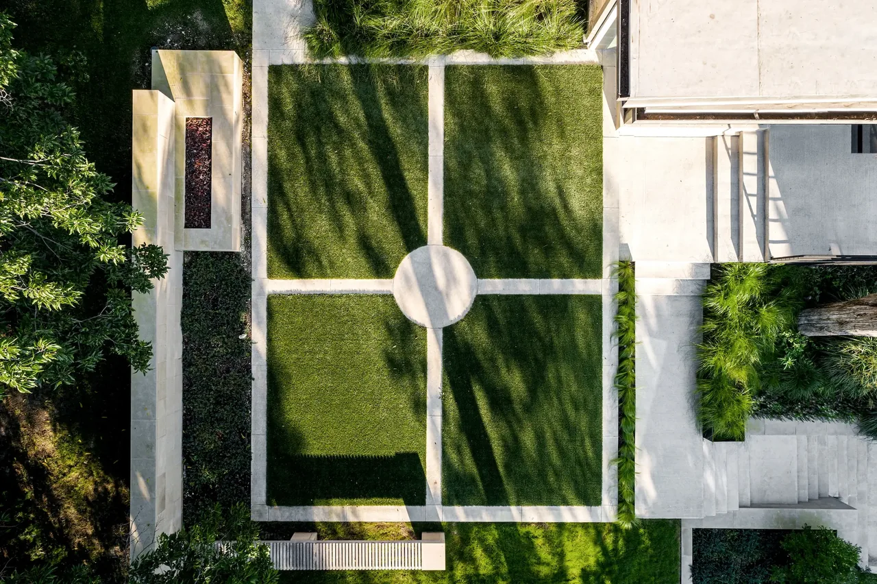 The Bungalow project features a geometric stepped entrance with concrete pathways and manicured lawns.