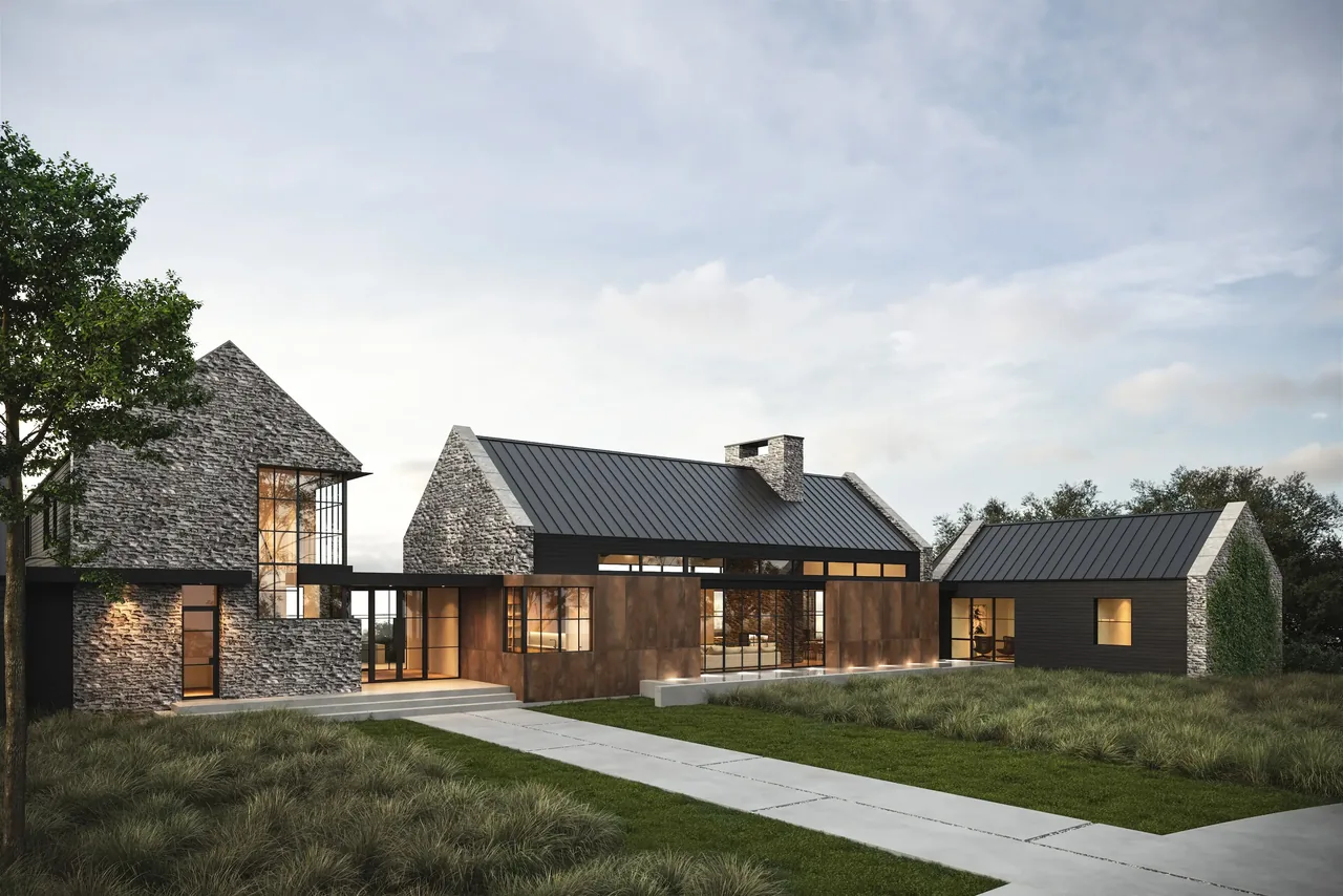 Modern stone house with metal roofing and large windows at Rabbit Ridge project.