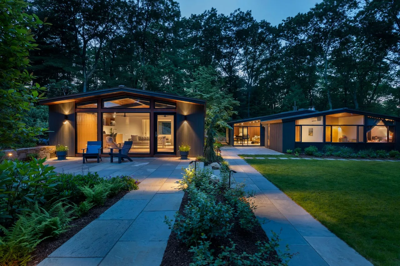 New Additions to Hoover + Hill project features two modern buildings with stone walkways and ambient garden lighting by Flavin Architects.