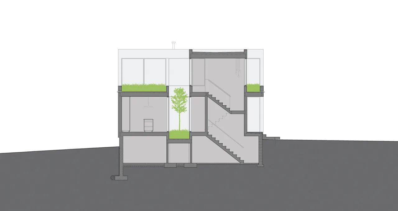 Section drawing of a house highlighting a central interior courtyard and staircases.