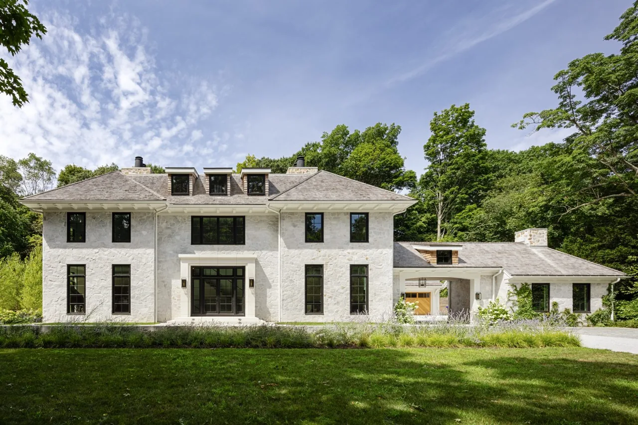 Birchwood Terrace features a stone facade with black window frames and a multi-gabled roof.