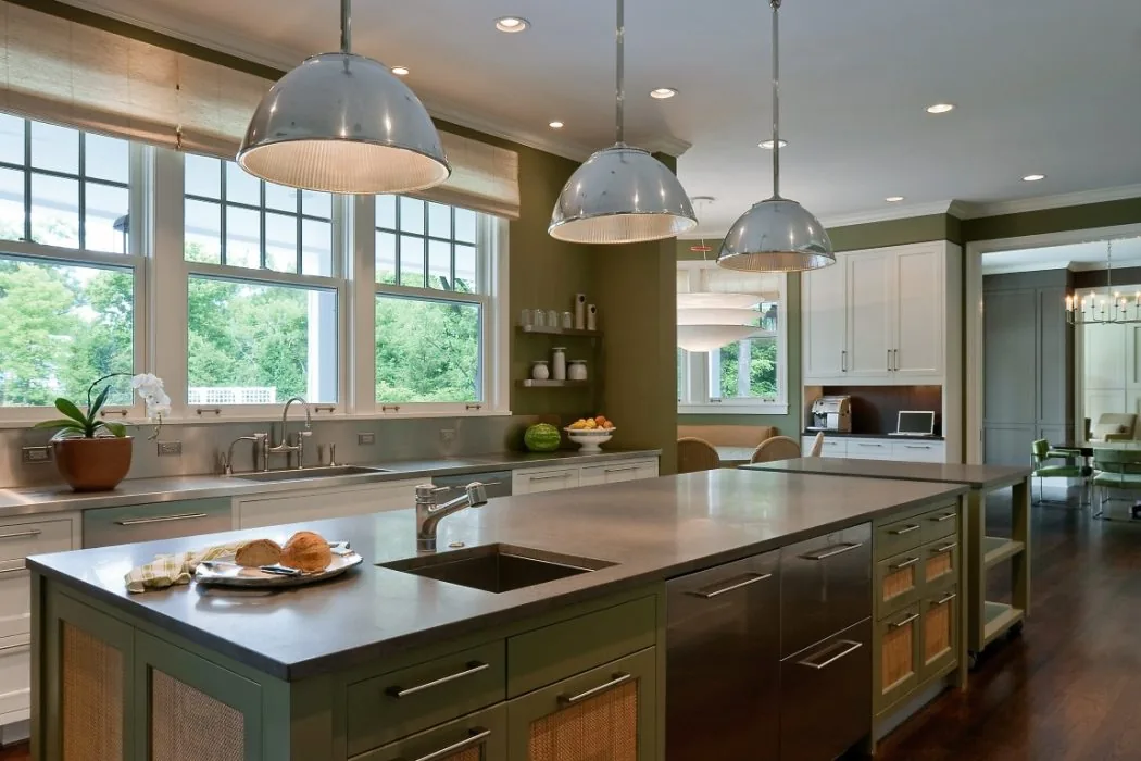 Kitchen with a large island, stainless steel sink, pendant lighting, and multiple windows providing natural light.