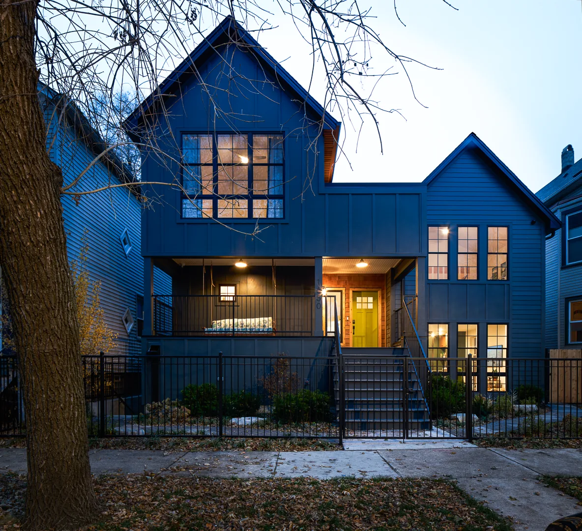 The Mozart House features a modern exterior with blue siding and a gable roof design.