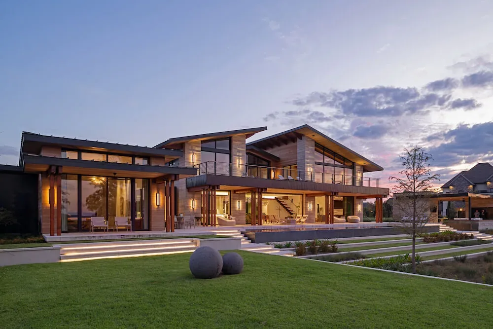 Pelican House in Austin features a modern exterior with large glass windows and varied rooflines by Winn Wittman Architecture.