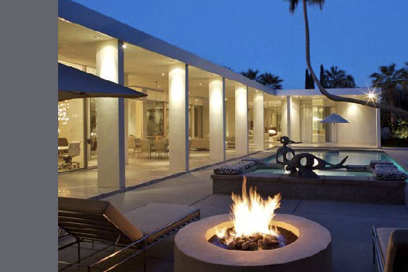 The Crescent project features an outdoor living area with a circular fire pit, pool, and floor-to-ceiling glazing in Los Angeles.