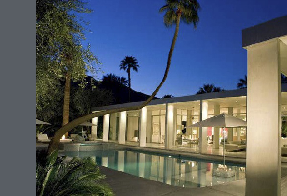 The Crescent project features a rectangular pool adjacent to a curved modern home facade illuminated at dusk.