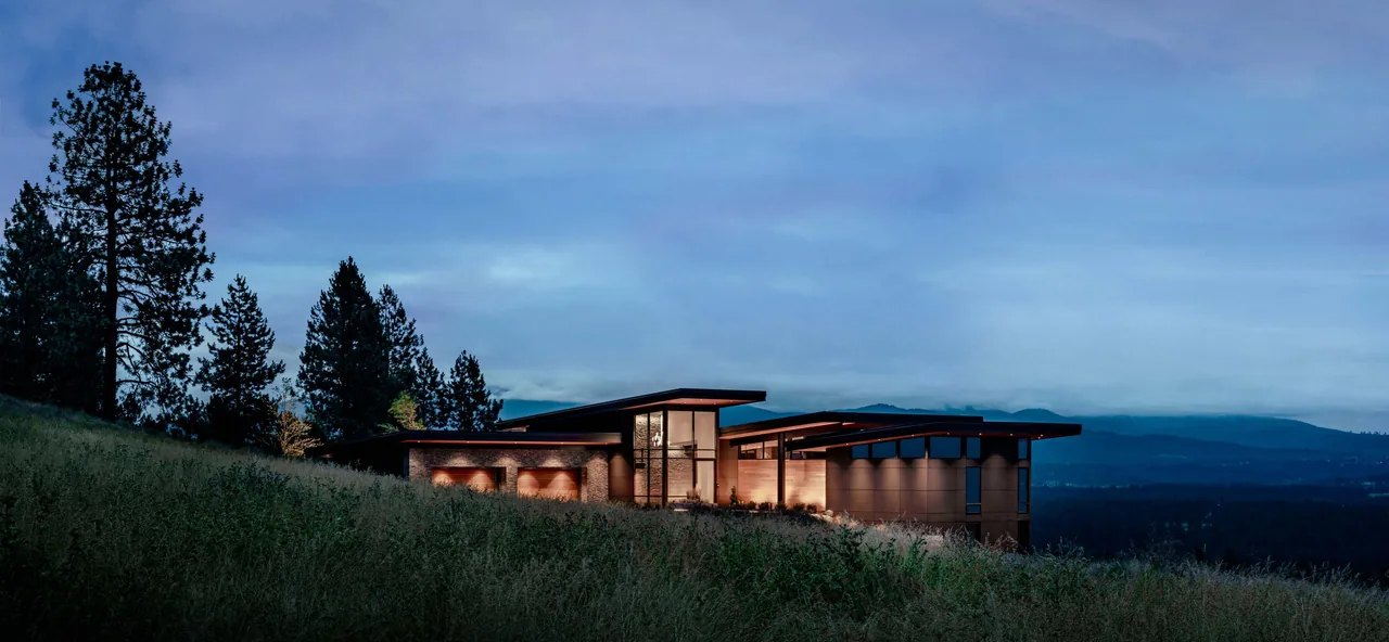 Saddle Mountain project by Uptic Studios, a modern hilltop house showcased at twilight lighting.