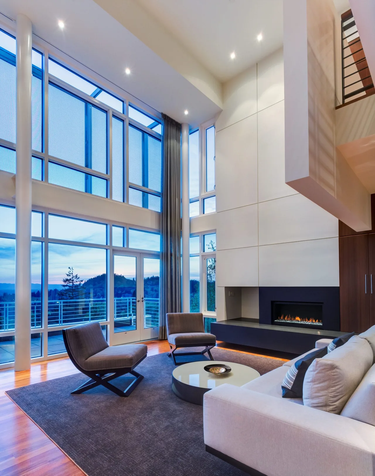 Living room in Hewett Street Residence features floor-to-ceiling glazing and a modern built-in fireplace.