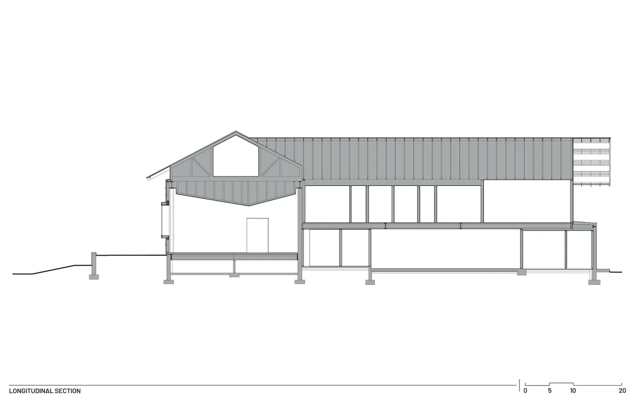 Longitudinal section drawing of Diagonal House displaying two-story layout with roof structure details.
