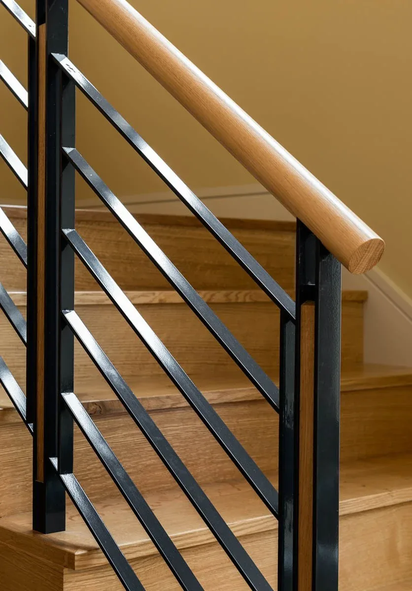 Wood and metal stair railing with wood handrail detail at Meadow Retreat.