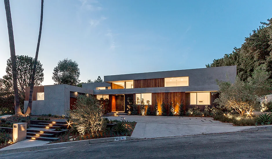 The Arby Residence showcases a two-story modern design with exterior landscape lighting by Space International Inc.