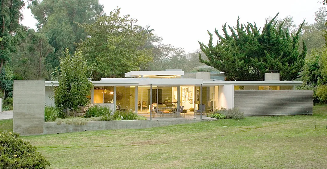 Bonsall Residence with floor-to-ceiling glazing and an exterior bench by Space International Inc.