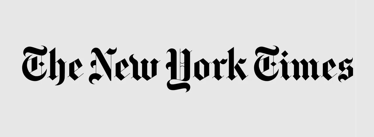 Framed artwork displaying The New York Times logo in black lettering.