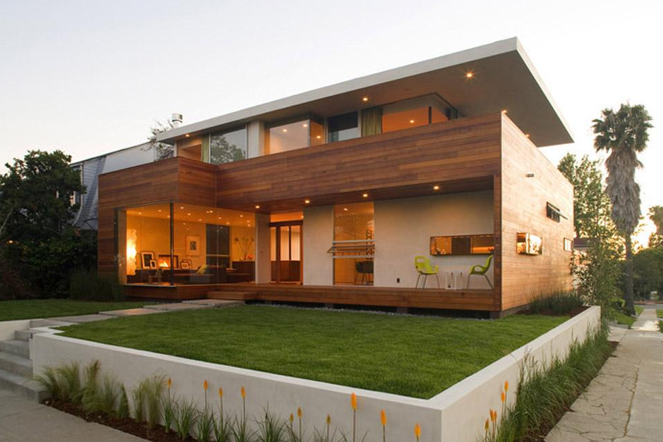Ridgewood Residence by Assembledge Architects features a two-story modern design with wood siding and a flat roof in Los Angeles.