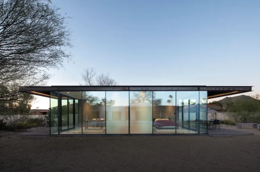 The ET Project is a modern glass house with a flat roof designed by Audesign Studio in Phoenix.