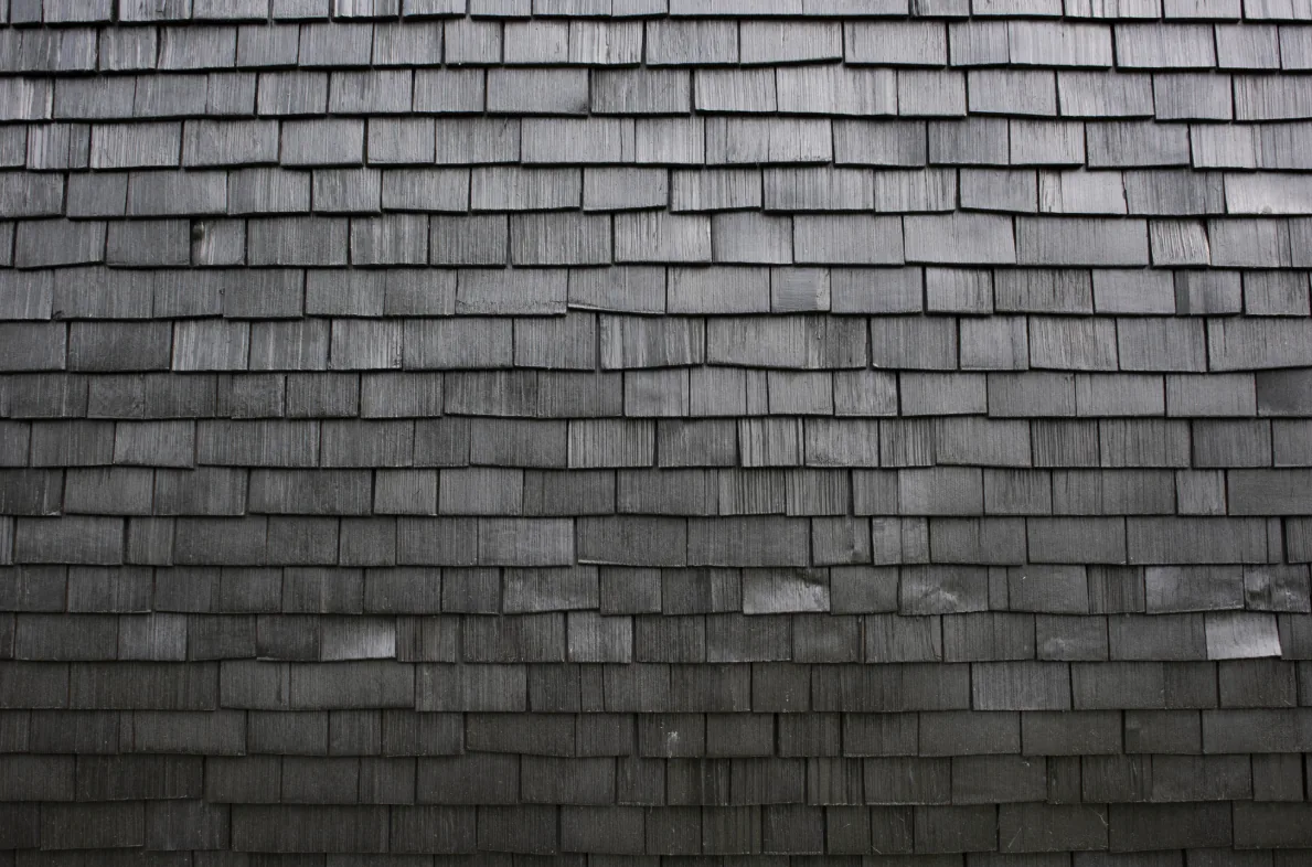 Gray wooden shingles used as siding on the exterior wall of Hudson Valley House II.