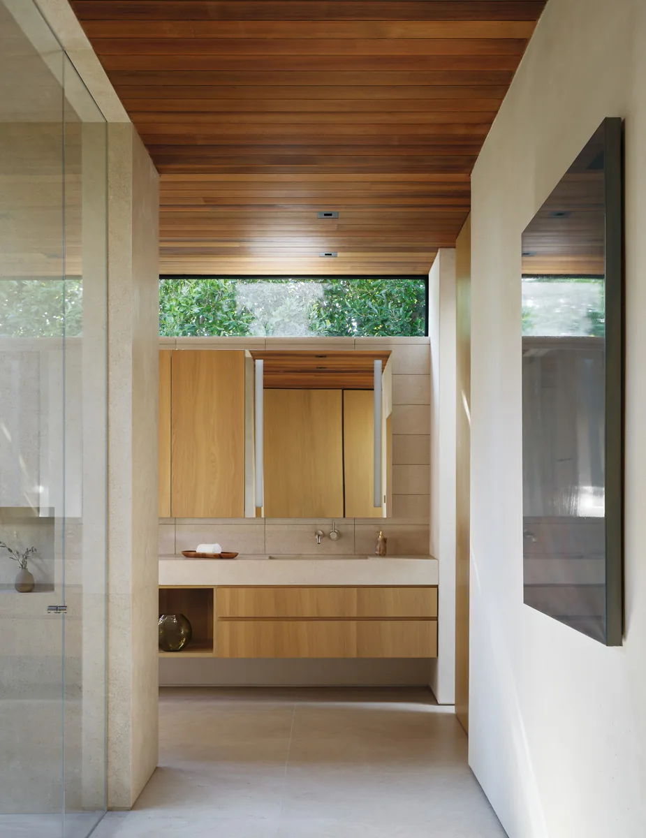 Bathroom featuring a wood paneled ceiling and cabinetry with a stone countertop, designed in a minimalist modern style.