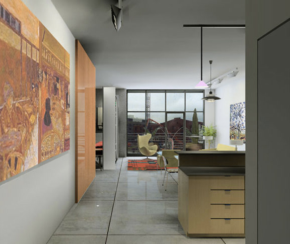 Interior view of a modern living and dining area with large floor-to-ceiling windows and polished concrete floors.