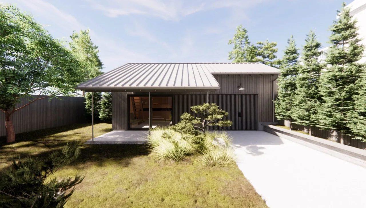 A small modern shed with a standing seam metal roof, vertical wood siding, and a covered patio area surrounded by grass and trees.